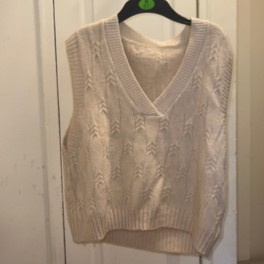 Hello cuties. We have a medium cream crew neck sweater. Great for layering.